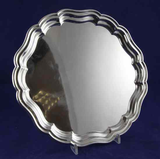 Appraisal: A 's silver salver of shaped circular form on bun