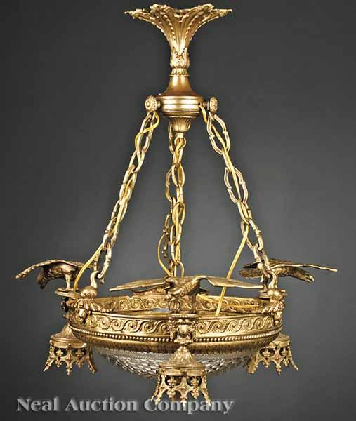 Appraisal: An Empire-Style Gilt Bronze Chandelier floral and urn-decorated corona supporting