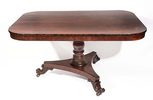 Appraisal: A VICTORIAN ROSEWOOD BREAKFAST TABLE rectangular top with rounded corners