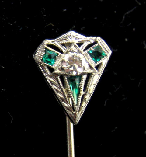 Appraisal: DIAMOND STICK PIN k white gold crest design with triangular