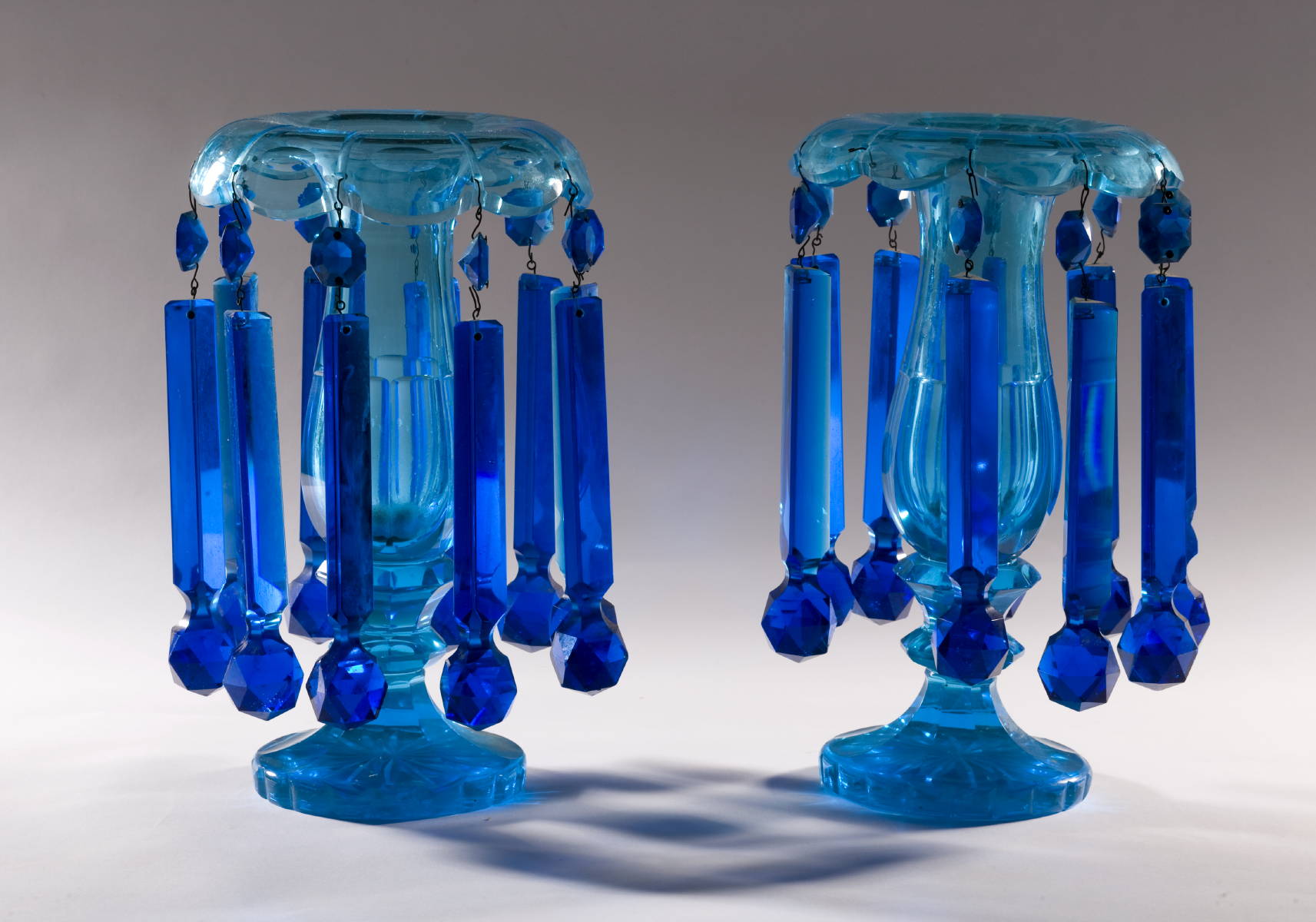 Appraisal: PAIR OF VICTORIAN BLUE-GREEN GLASS LUSTRES WITH SCALLOPED FOOT AND