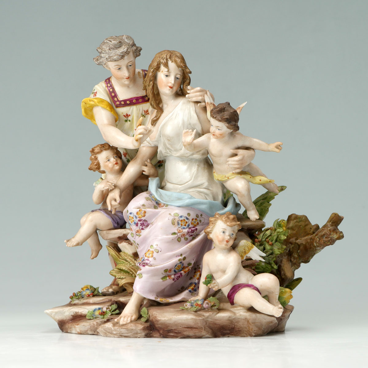 Appraisal: VOLKSTEDT PORCELAIN LOVING COUPLE WITH CHERUBS Volkstedt porcelain male semi-nude