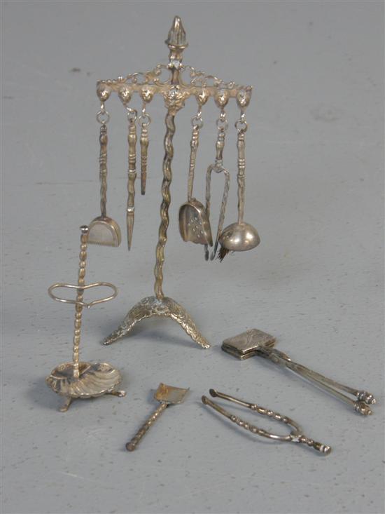 Appraisal: Dutch miniature silver coloured metal firestand with six implements high