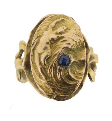 Appraisal: A gold ring depicting a nude nymph with a swirling