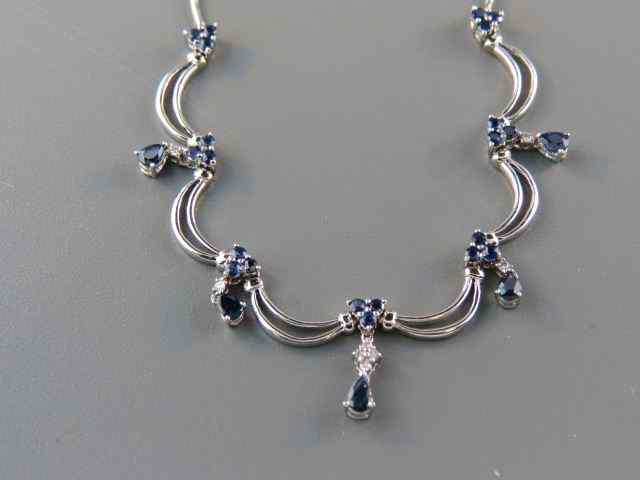 Appraisal: Diamond Sapphire Necklace dangling pear shaped gems with round gems