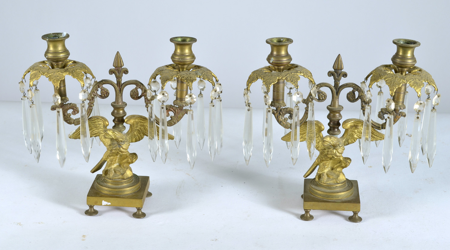 Appraisal: PAIR OF TWO-SOCLE GILT METAL CANDELABRA in an eagle design