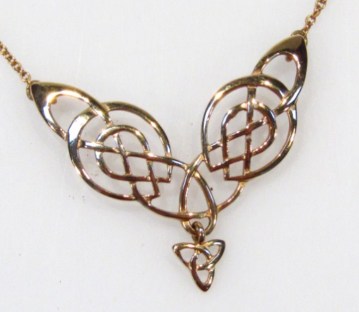 Appraisal: An elaborate Art Nouveau design pendant of part pierced outline