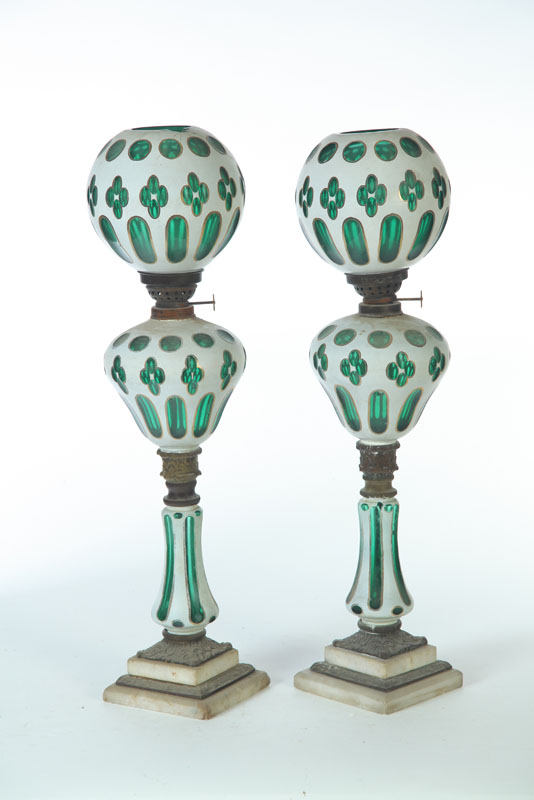 Appraisal: PAIR OF CUT OVERLAY QUATREFOIL BANQUET LAMPS European nd half-