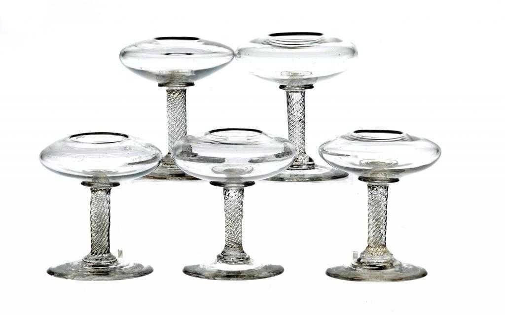 Appraisal: FIVE SIMILAR GLASS 'LACEMAKER'S' LAMPS the compressed circular reservoir on