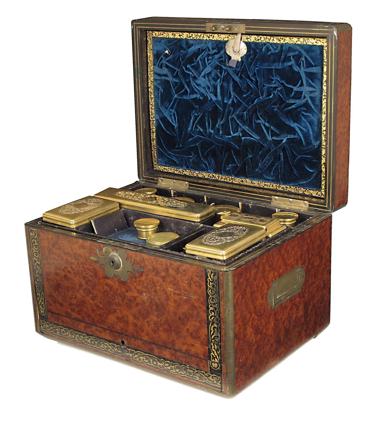 Appraisal: A George IV amboyna and brass marquetry toilet box with