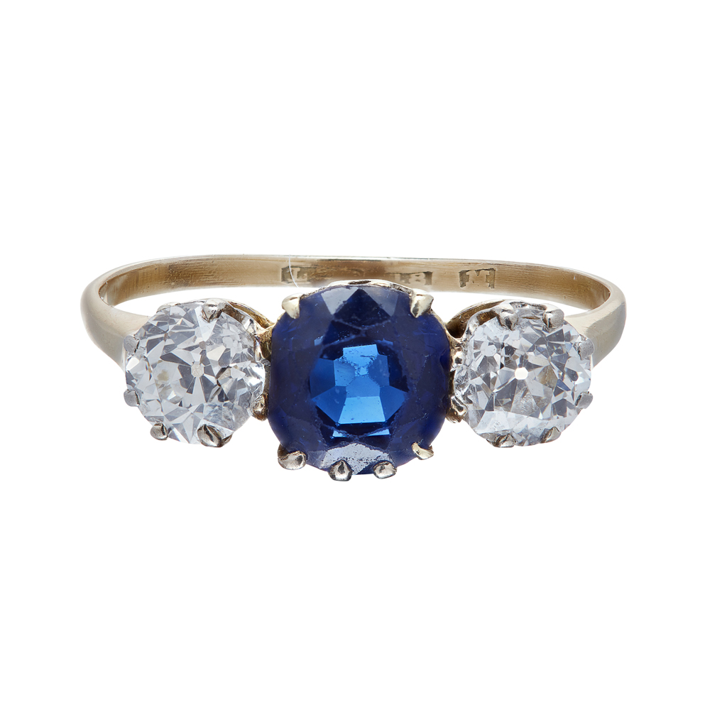 Appraisal: A three stone sapphire and diamond set ring claw set