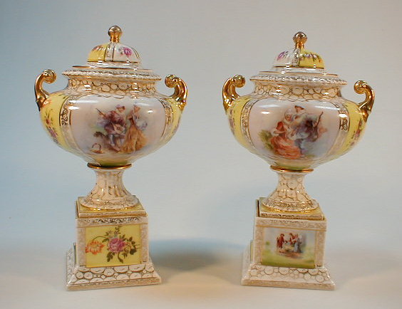 Appraisal: A pair of pedestal porcelain vases with covers in the