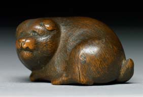 Appraisal: ANTIQUE WOOD NETSUKE Charming and antique carved wood netsuke of