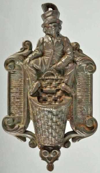 Appraisal: Cast Iron Wall Match Holder Description Depicts man smoking a