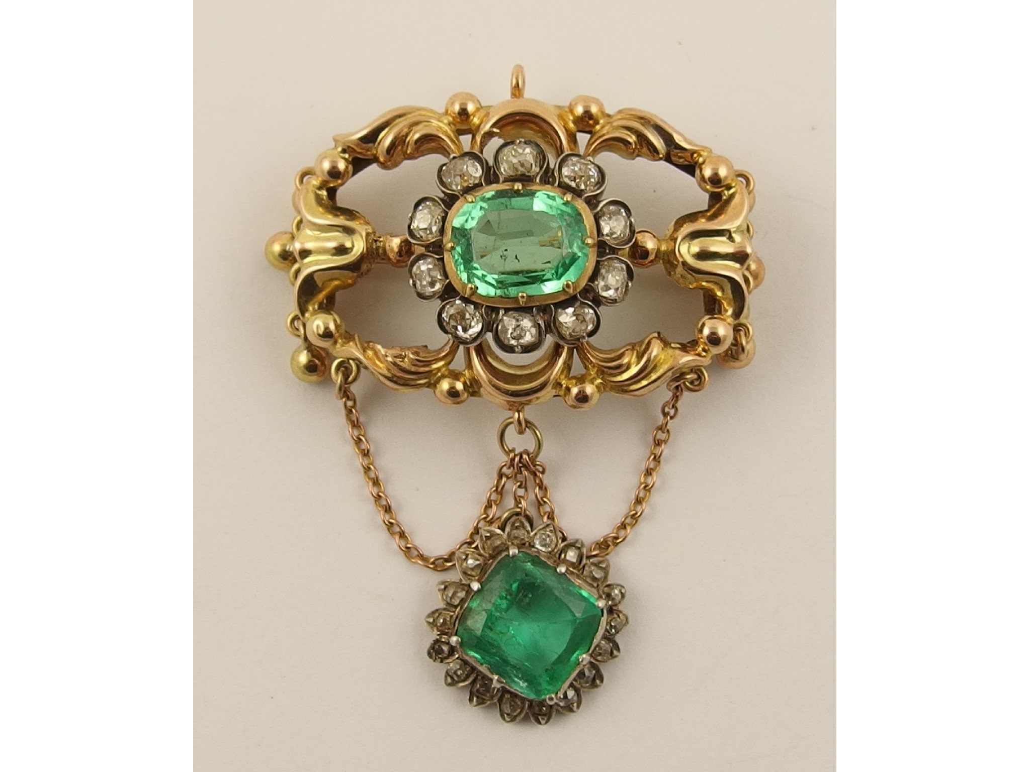 Appraisal: A Victorian emerald and diamond pendant broochthe open work floral