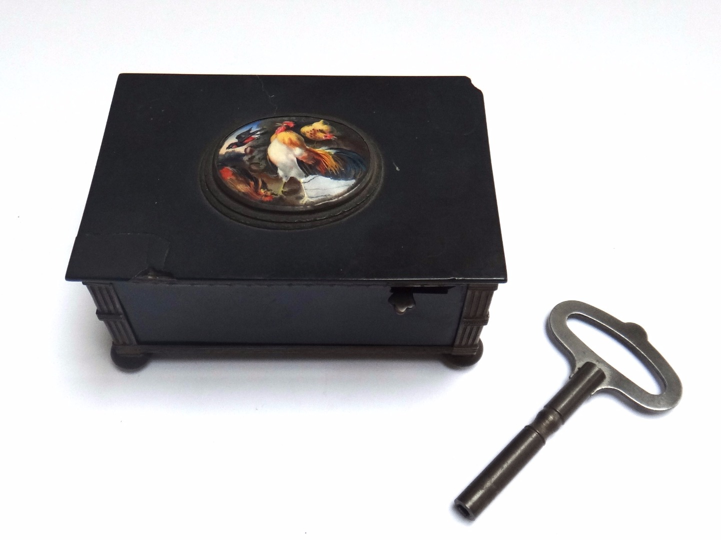 Appraisal: A Continental black lacquered musical box th century the enamel