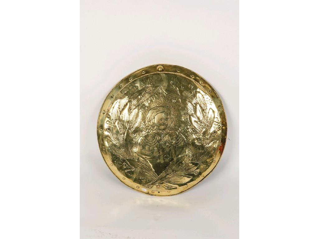 Appraisal: A BROAD HAMMERED BRASS BASIN embossed with a figure within