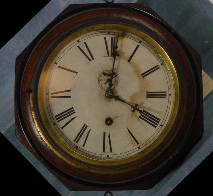 Appraisal: Oak Waterbury day lever clock paper dial stains overall diameter