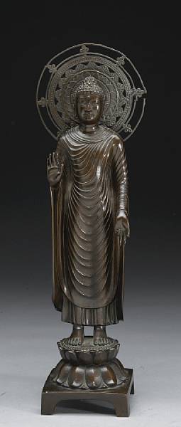 Appraisal: A bronze figure of Sakyamuni Buddha Showa Period Standing on