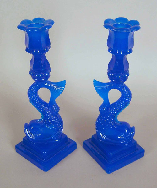 Appraisal: Pair of reproduction dolphin candlesticks h