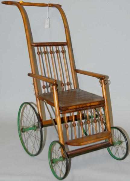 Appraisal: Child's Wooden Stroller Wheelchair By Heywood Green wheels Folds up