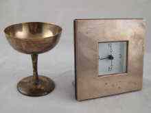 Appraisal: A silver fronted clock approx x cm together with a