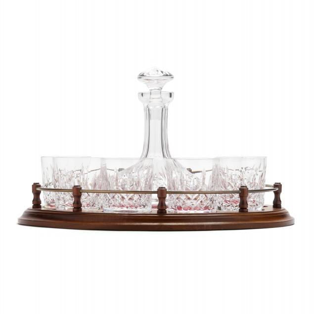 Appraisal: WATERFORD LISMORE CRYSTAL SHIP'S DECANTER SIX TUMBLERS AND STAND Mahogany