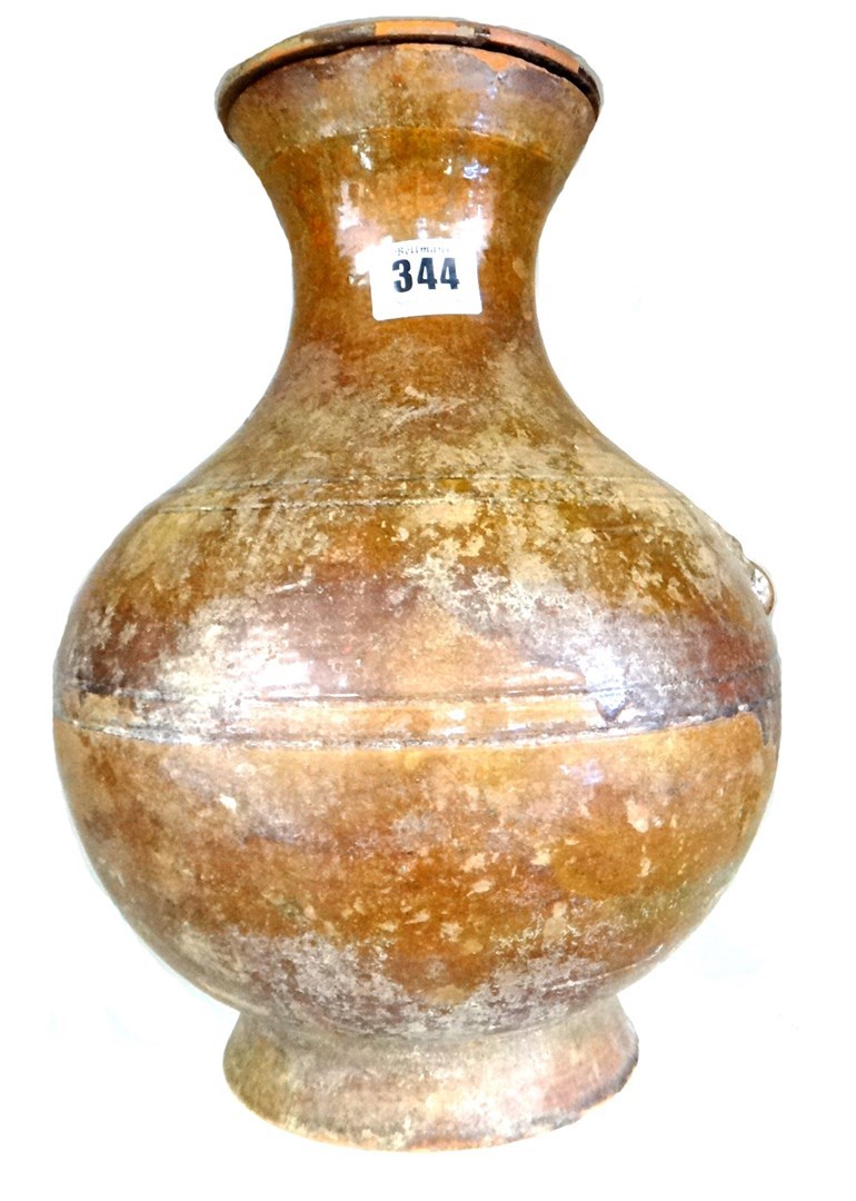 Appraisal: A Chinese brown glazed pottery vase and cover Han Dynasty