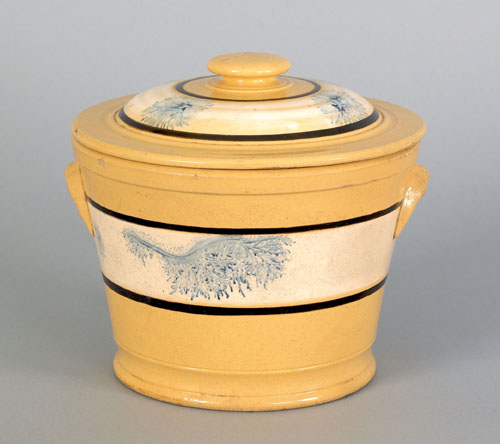 Appraisal: Yellow mocha covered canister th c with seaweed decoration h