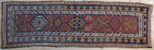 Appraisal: Caucasian runner early th c with medallions on a red