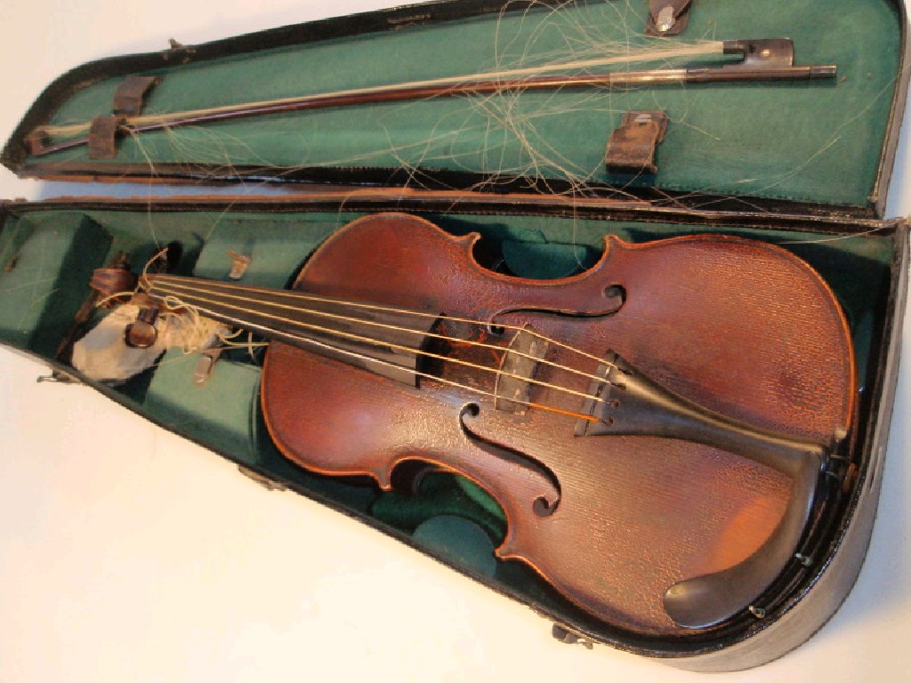 Appraisal: A cased violin with bow both unsigned cm C w