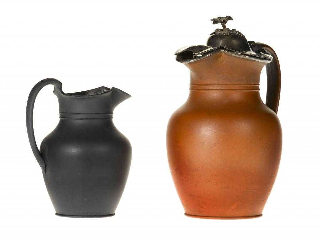 Appraisal: TWO WEDGWOOD DRY BODIED CLUB JUGS of Rosso Antico with