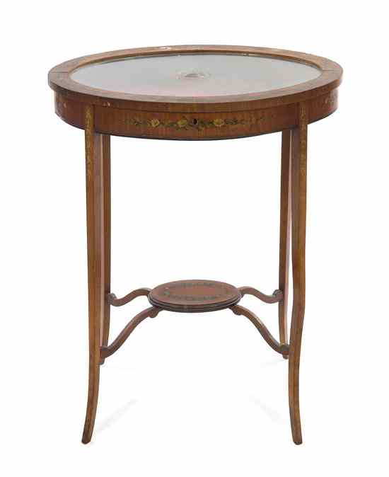 Appraisal: An Edwardian Satinwood Vitrine Table the oval hinged top inset