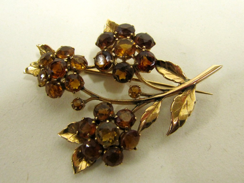 Appraisal: Yellow metal spray brooch with citrine cluster flowers