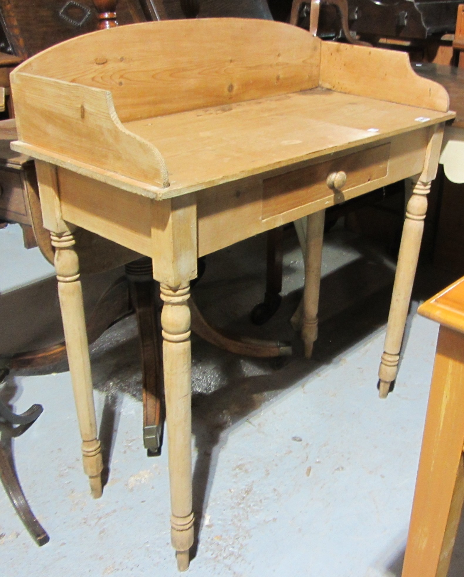 Appraisal: A pine washstand with three quarter galleried back