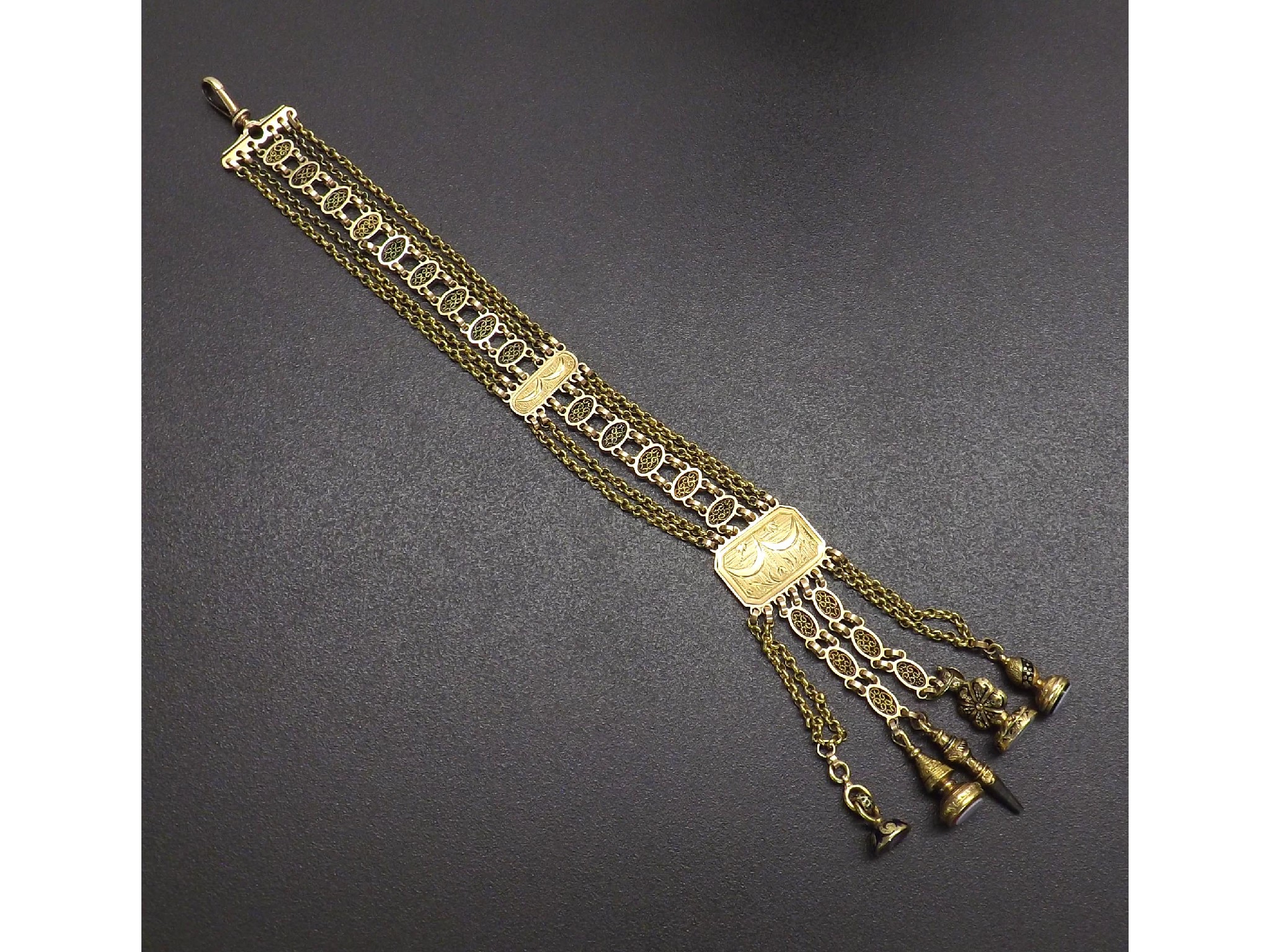 Appraisal: Good th century yellow gold chatelaine with oval and belcher