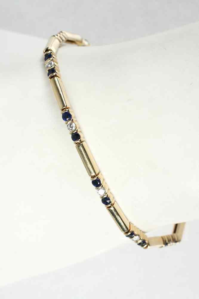 Appraisal: BRACELET - One K yellow gold sapphire and diamond link