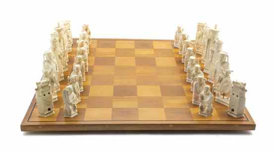 Appraisal: A Chinese Carved Ivory Chess Set comprising thirty-two pieces and