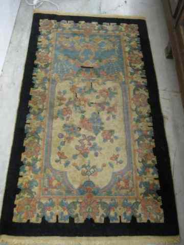 Appraisal: Chinese Handmade Rug floral ivory field black border ' ''