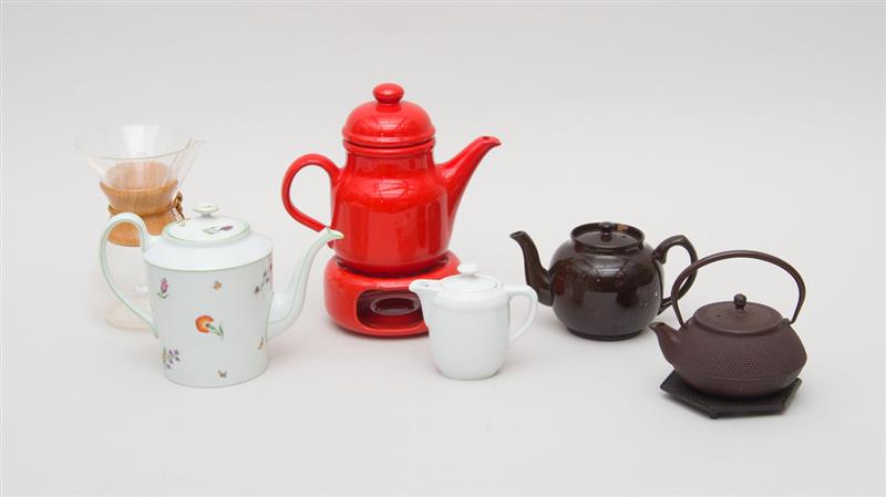 Appraisal: GROUP OF FOUR CERAMIC TEAPOTS The large floral teapot on