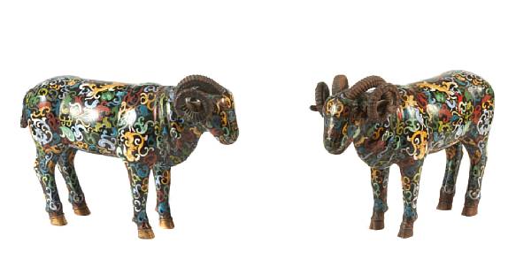 Appraisal: A pair of Chinese cloisonne models of rams losses to