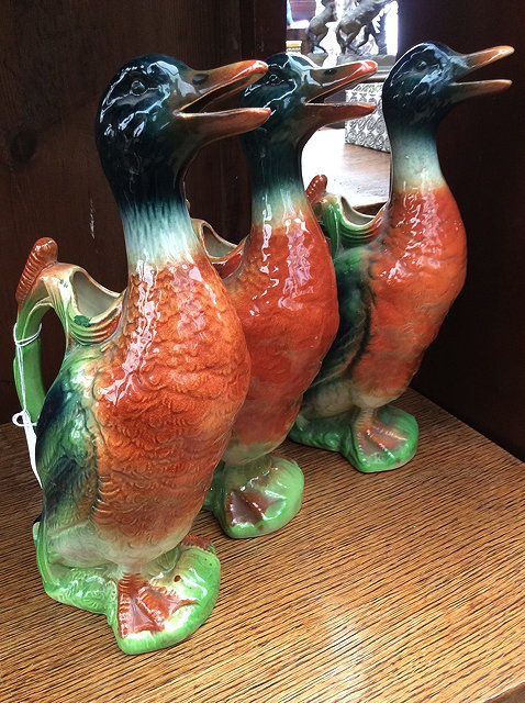 Appraisal: THREE ST CLEMENTS OF FRANCE POTTERY DUCK DECANTERS each cm