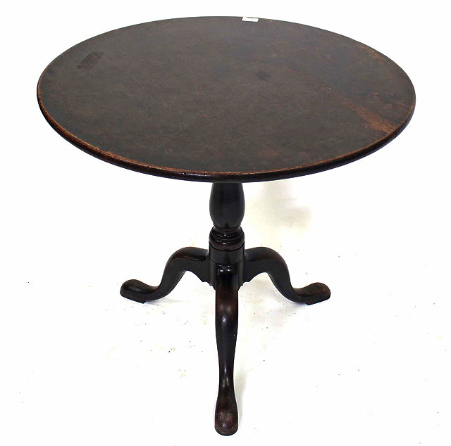 Appraisal: AN ANTIQUE MAHOGANY TILT TOP TRIPOD TABLE on turned column