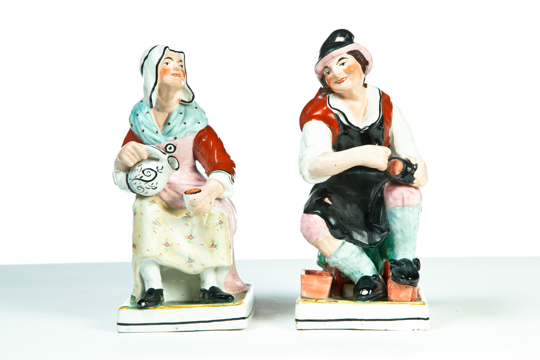 Appraisal: TWO STAFFORDSHIRE FIGURES England nd half- th century High glaze