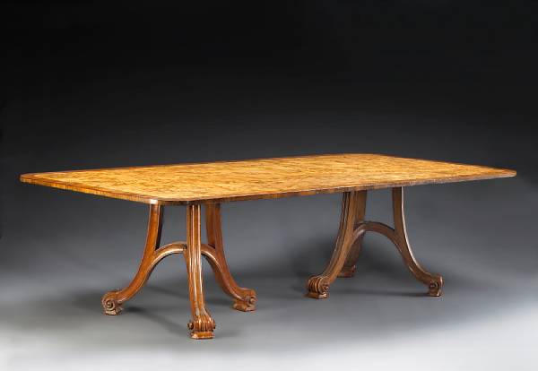 Appraisal: An Italian Art Nouveau style crossbanded burlwood dining table The