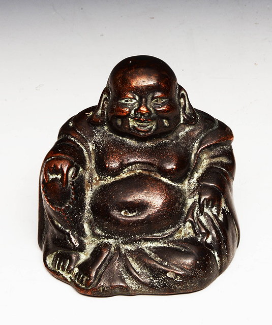 Appraisal: AN OLD BRONZE SEATED BHUDDA smiling visage cm high