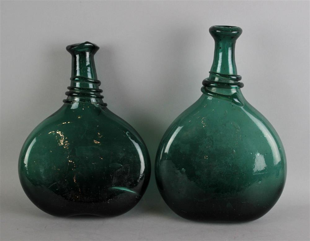 Appraisal: TWO BLOWN GREEN GLASS BOTTLE FLASKS with trail decorated necks