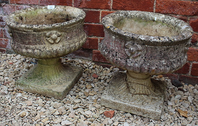 Appraisal: A PAIR OF CONCRETE GARDEN PLANTERS each of cylindrical form