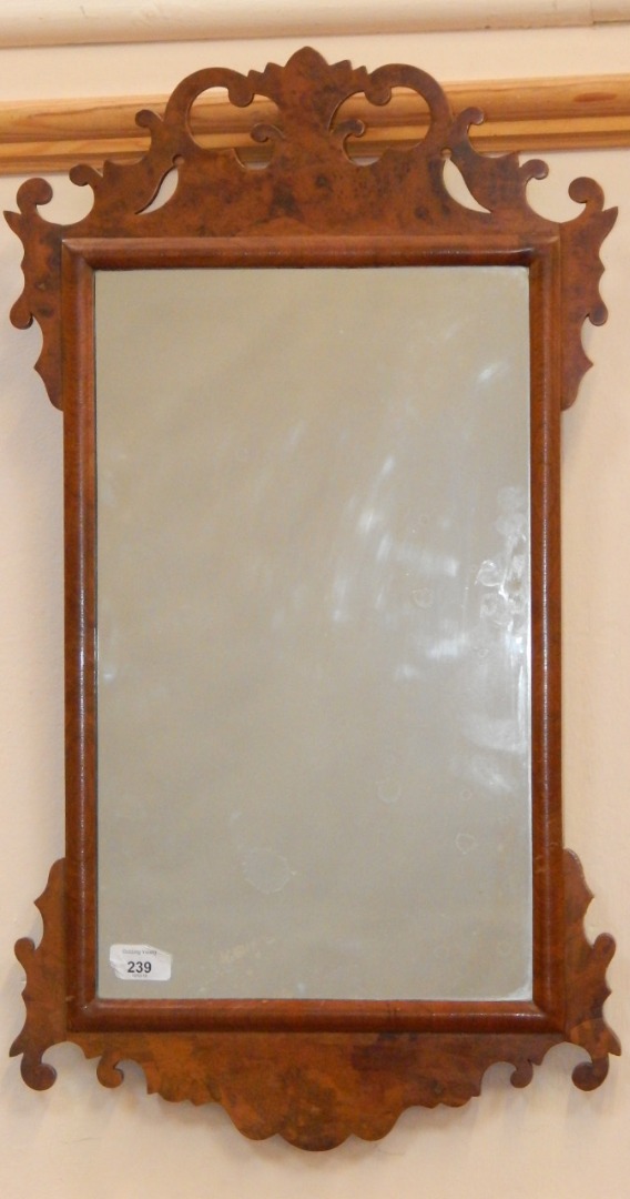 Appraisal: A Georgian style burr walnut fretwork wall mirror early thC