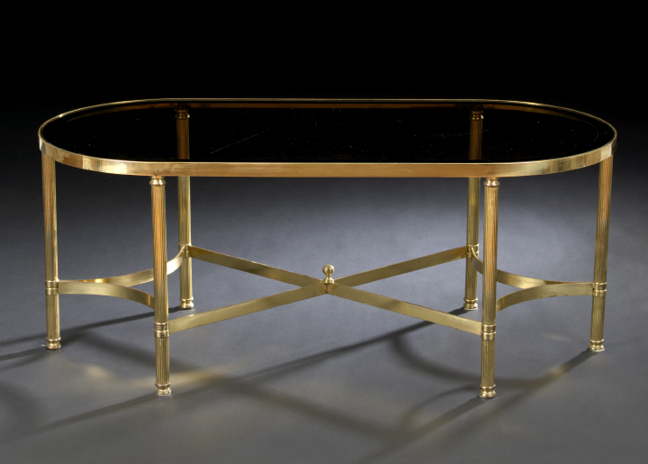 Appraisal: Louis XVI-Style Gilt-Metal and Smoked Glass Cocktail Table the oval